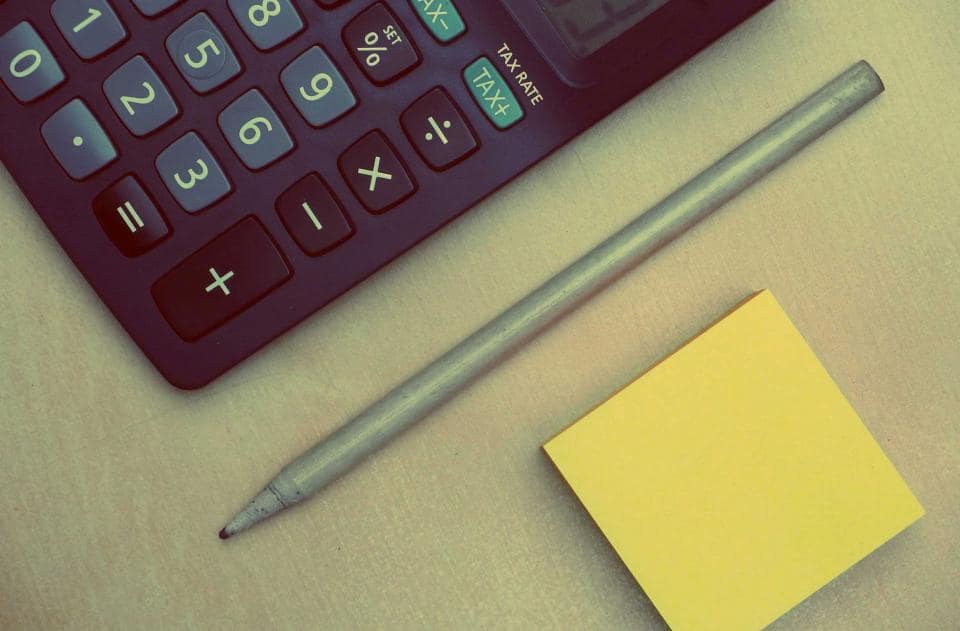 Financial documents and calculator on a desk