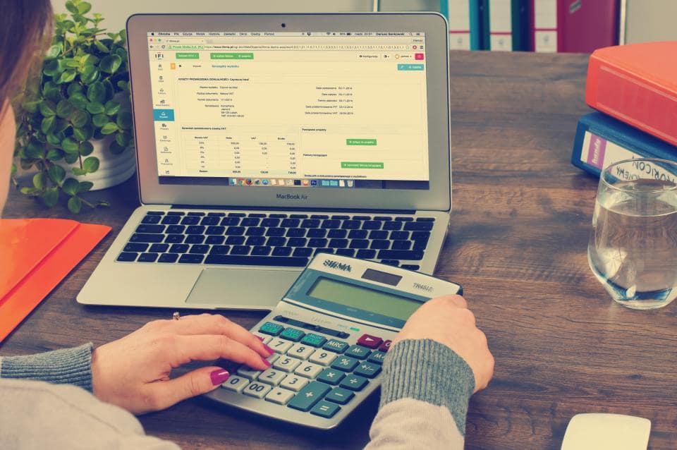 Financial documents and calculator on a desk