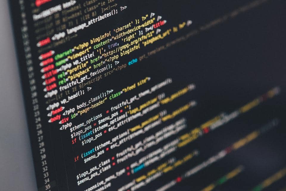 Developer writing software on a computer